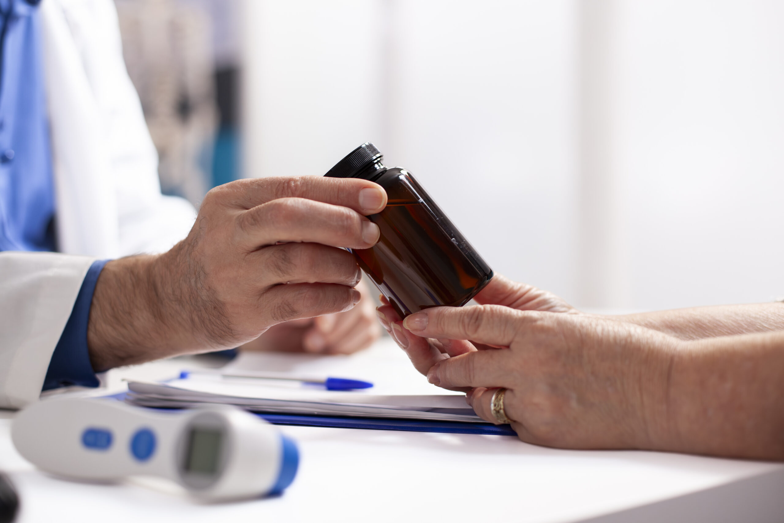 white people holding bottle pills scaled