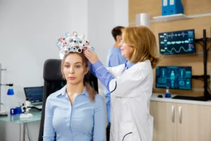 female scientist who puts brain waves scanning device female patient clinical study brain activity