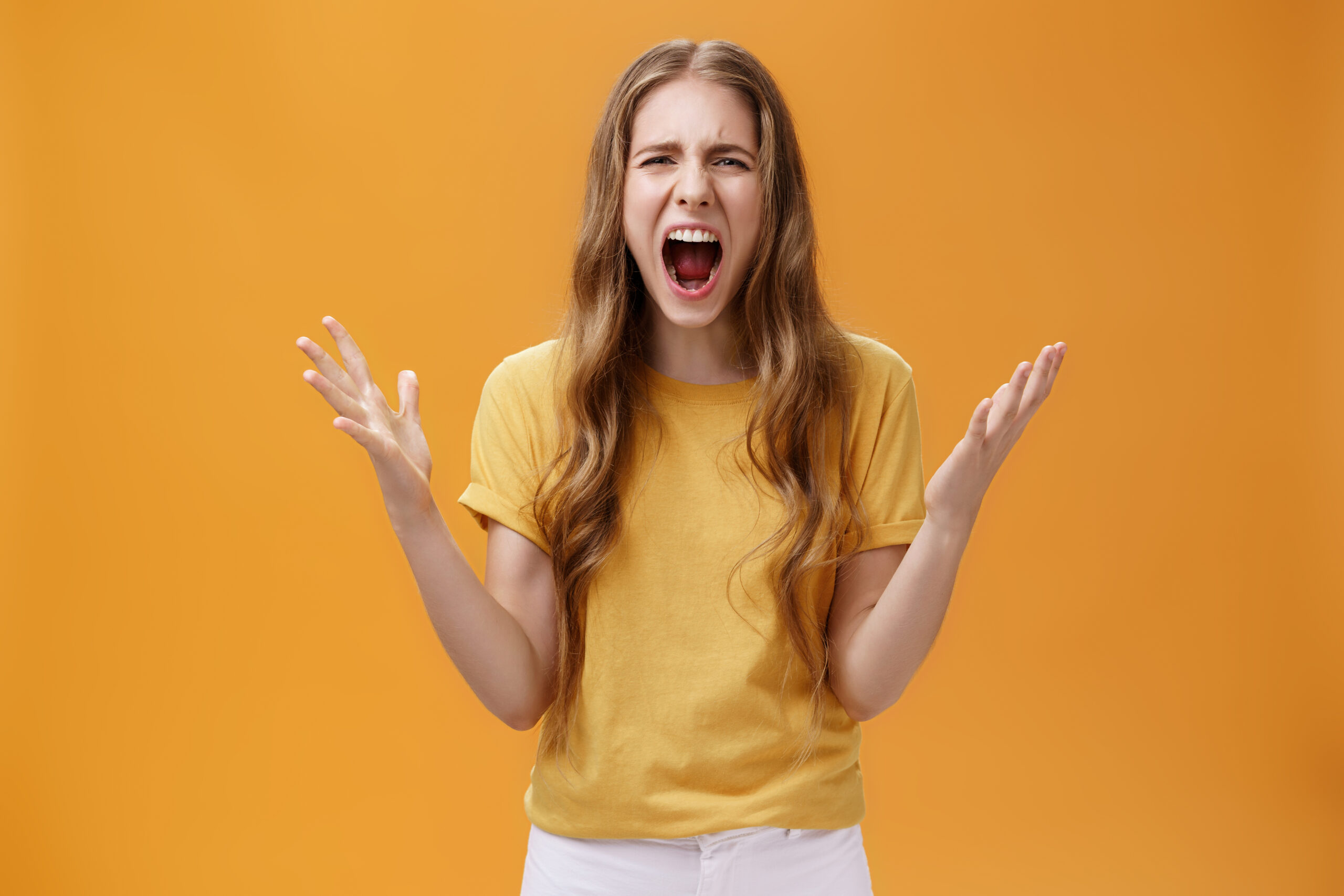 studio shot young woman argument losing temper standing pressured pissed yelling out l scaled